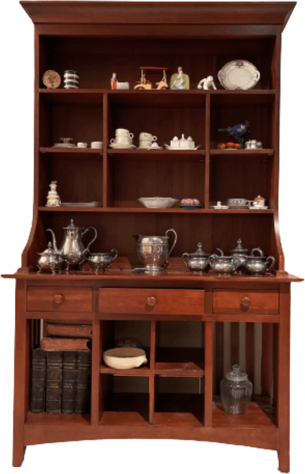 A wooden cabinet with many cups and saucers on it.