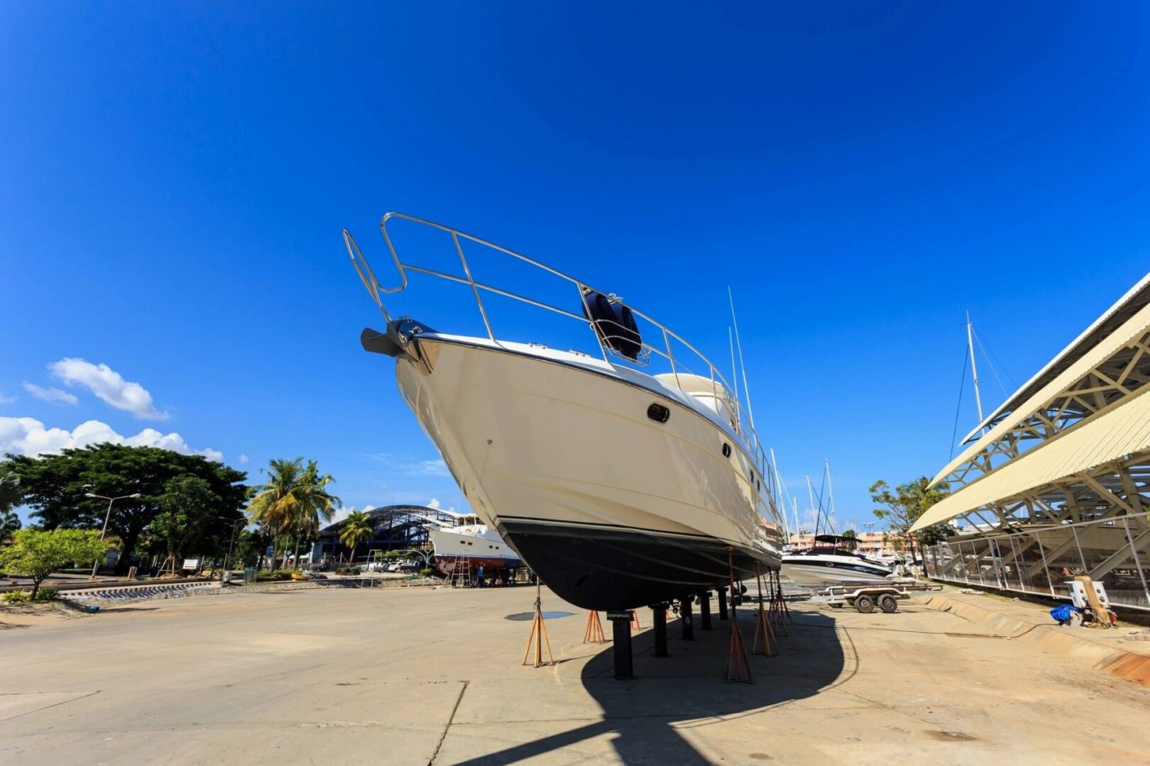 A boat is parked on the dock in a marina.